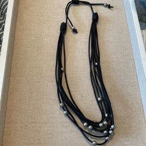 Black Leather 8 strand necklace with silver tone beads. 18” plus extender.